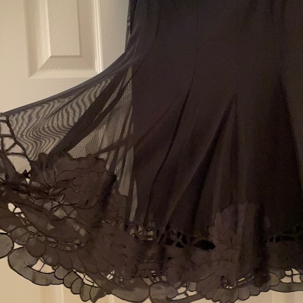 Beautiful black skirt with lace cut out on hem